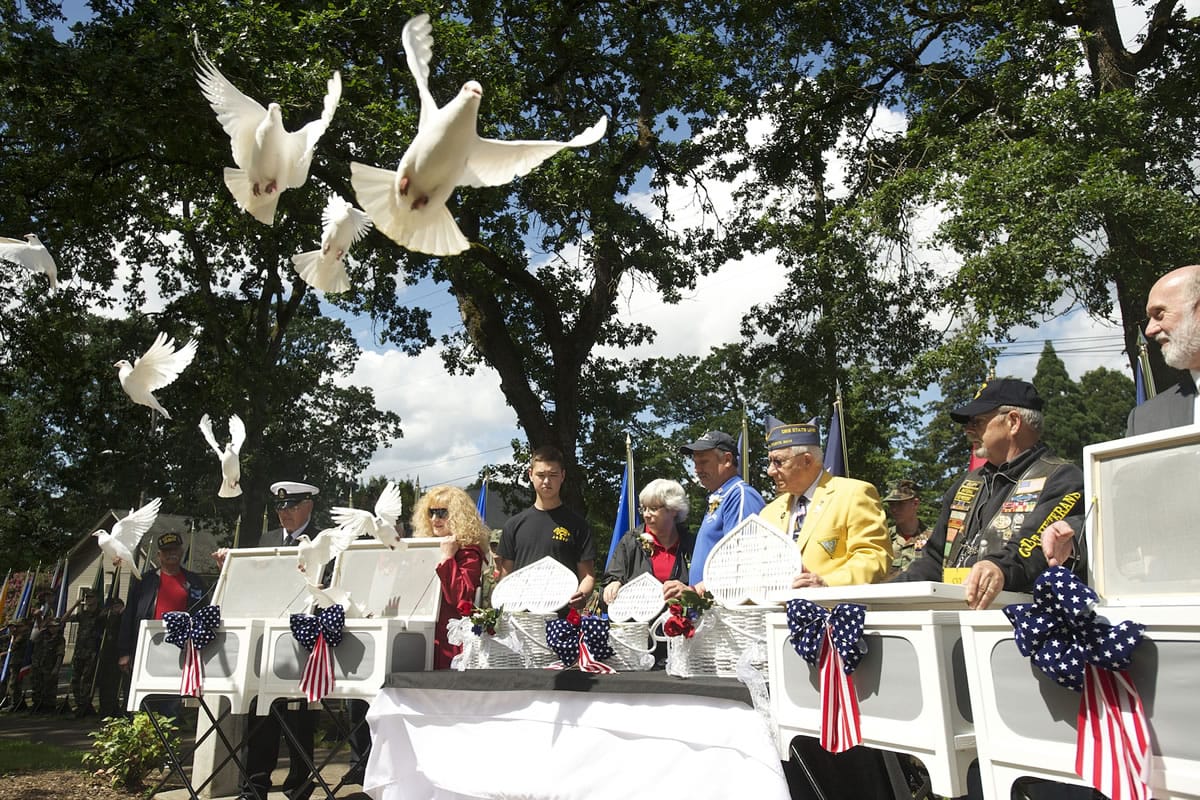 White doves are released May 26, 2014 in memory of those who died in the line of duty, including Air Force Capt. Chris Stover, during an observance at the Clark County Veterans War Memorial. Stover died Jan. 7 when his helicopter crashed in England during training.