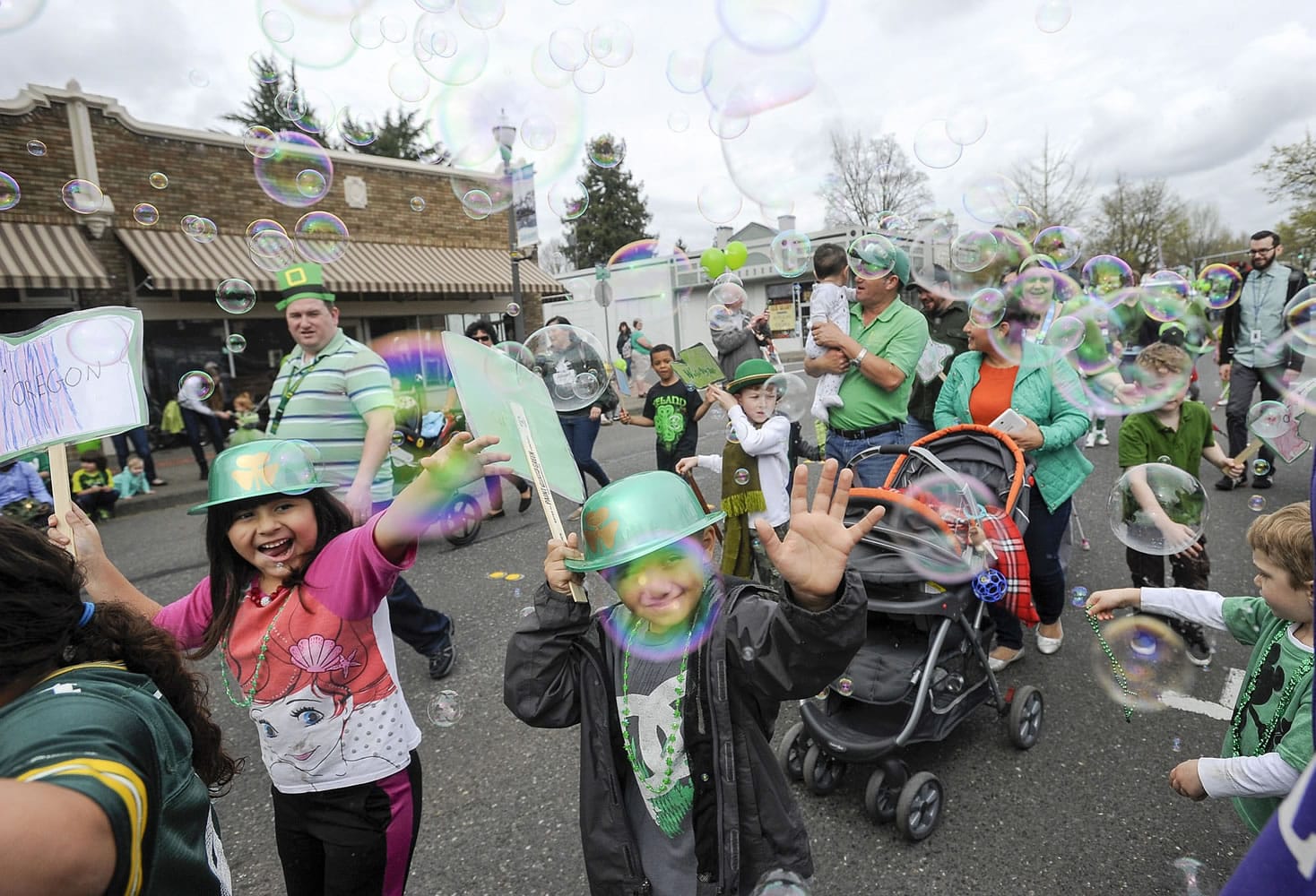 Children were enchanted by a bubble machine along the parade route of the 24th Annual Paddy Hough Parade featuring students at Hough Elementary.