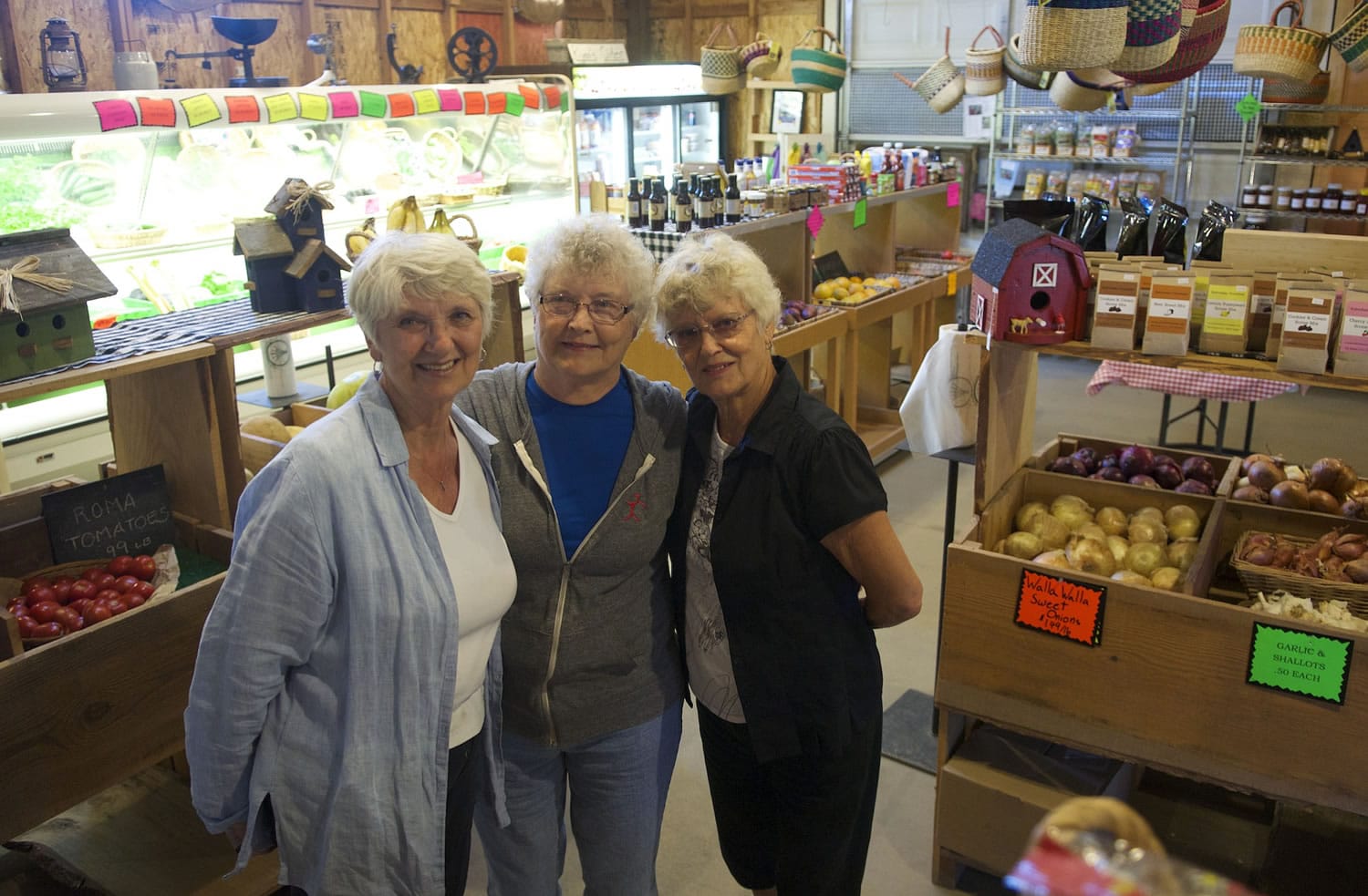 Sisters Carol Hoffman, left, Karen Yankee and Glenda Hergert are proud of their past and sad about the inevitable end of their Felida Red Barn, which started out as the Kramer family farm and is set to become Kramer's Corner, a residential subdivision.