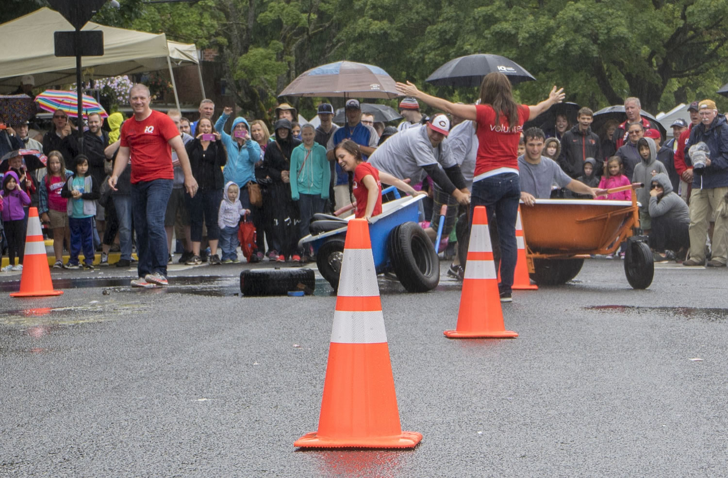 Organizers changed the format of this year's bathtub races at Camas Days on Saturday after one of the two tubs broke during a race between team iQ Credit Union (in red) and team Pediatric Stroke Awareness.