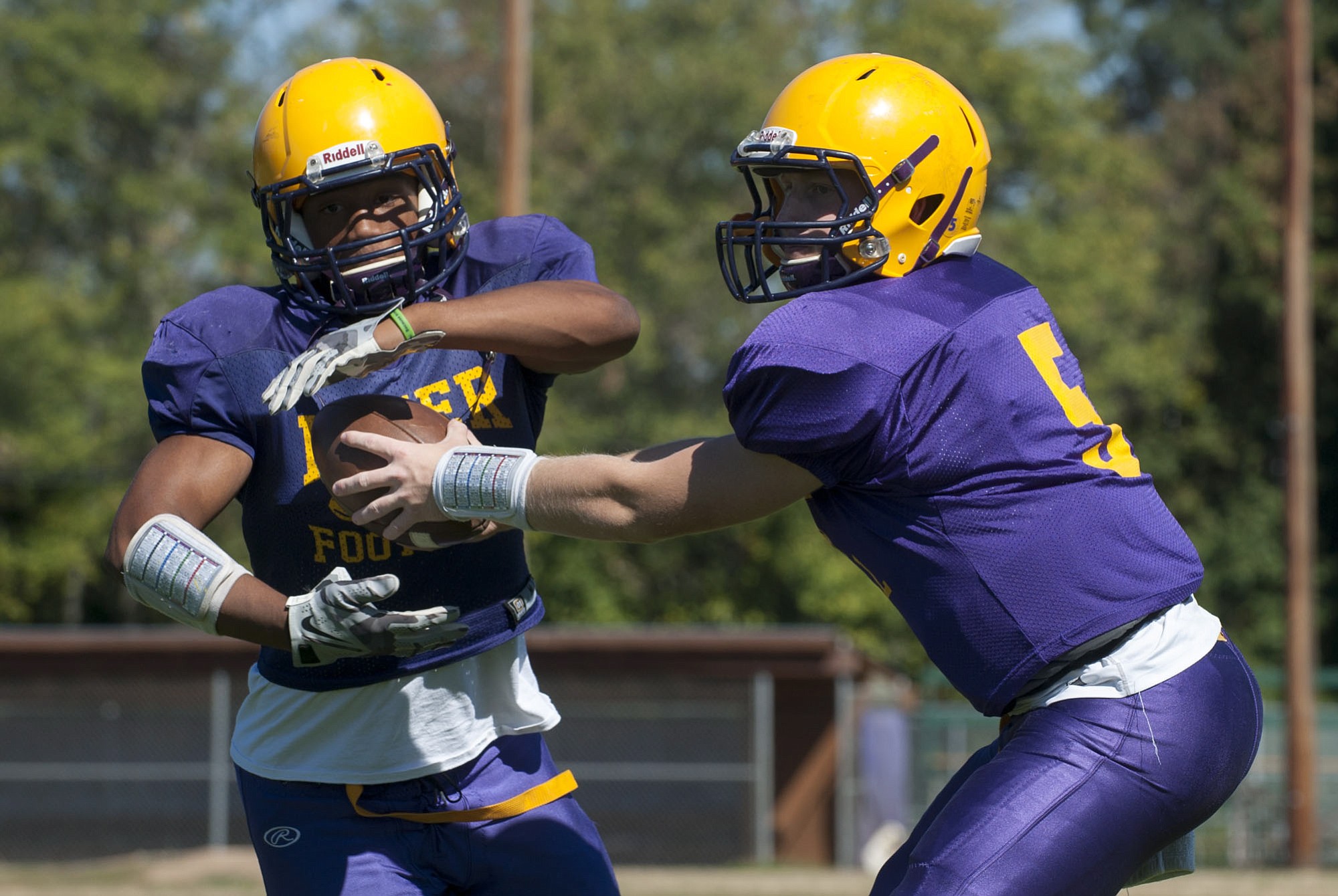 Running back Travon Santiago (L) and Quarter back Garrett McKee at a football practice at Columbia River High School in Vancouver Monday August 25, 2015.