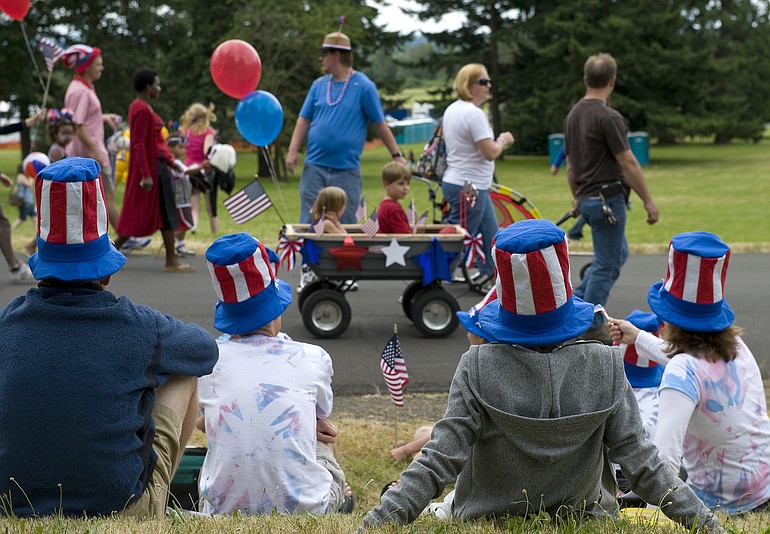 Children 12 and younger were free for this years Independence Day celebration at Fort Vancouver, but organizers estimate that at least 15,000 attended with some 20,000 adults.