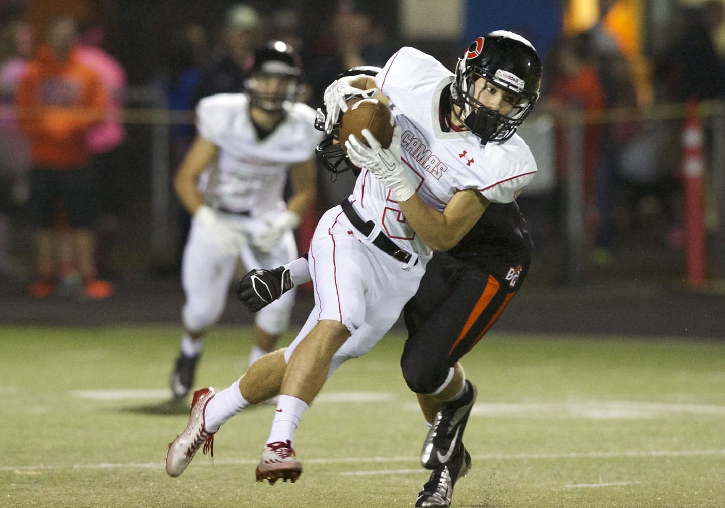 Camas' Jared Bentley carries the ball for a big gain against Battle Ground, Thursday, October 9, 2014.