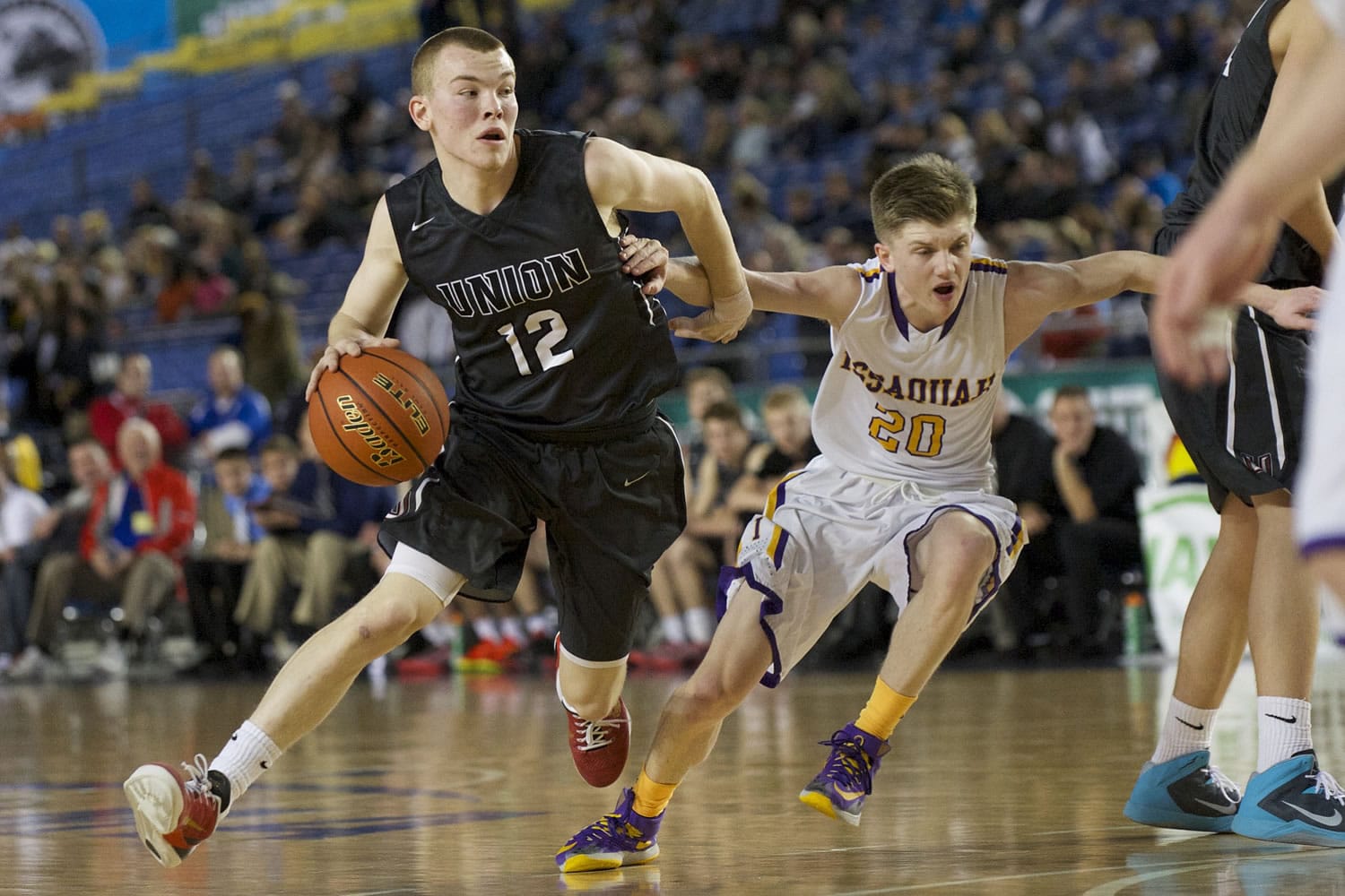 Micah Paulson makes a move to the basket as Union beats Issaquah 63-55 at the 2015 WIAA Hardwood Classic 4A Boys tournament at the Tacoma Dome, Thursday, March 5, 2015.