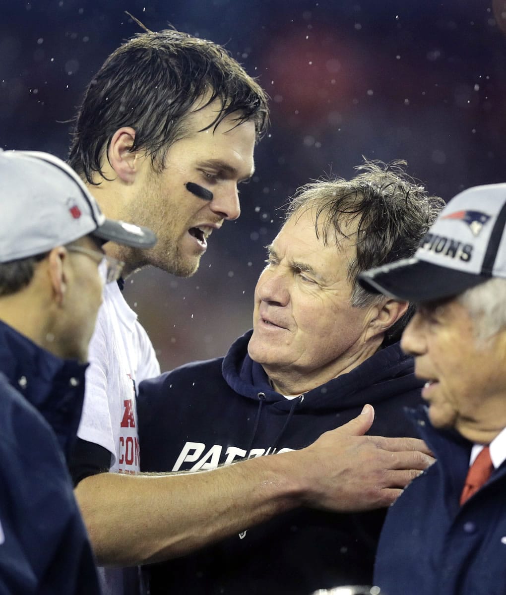 New England Patriots quarterback Tom Brady, left, speaks with Bill Belichick after winning the AFC Championship game Sunday, Jan. 18, 2015, in Foxborough, Mass. The Patriots defeated the Colts 45-7 to advance to the Super Bowl against the Seattle Seahawks.
