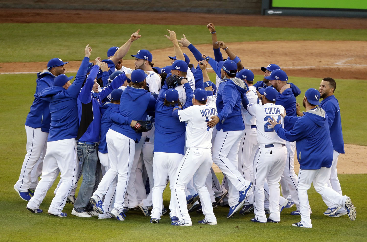 The Kansas City Royals players celebrate after the Royals defeated the Baltimore Orioles 2-1 in Game 4 of the American League Championship Series on Wednesday, Oct. 15, 2014, in Kansas City, Mo. The Royals advance to the World Series.
