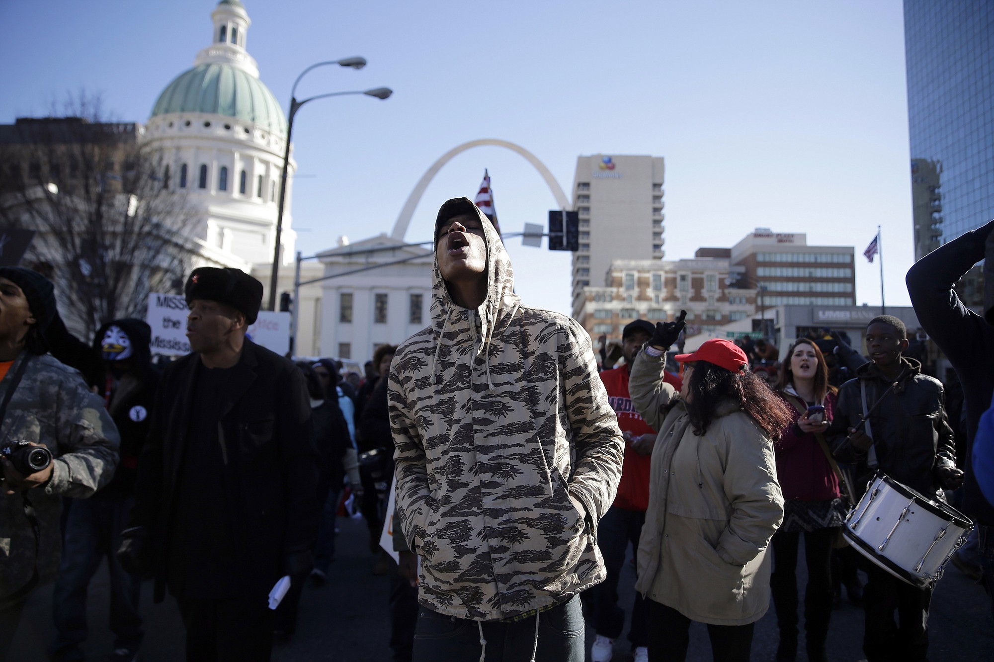 People chant while taking part in an annual march Monday honoring the Rev. Martin Luther King Jr. in St. Louis.