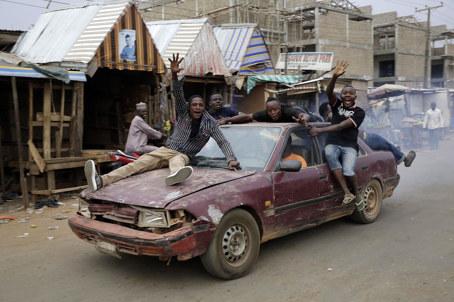 People celebrate the victory of presidential candidate Muhammadu Buhari on Tuesday in Kaduna, Nigeria.