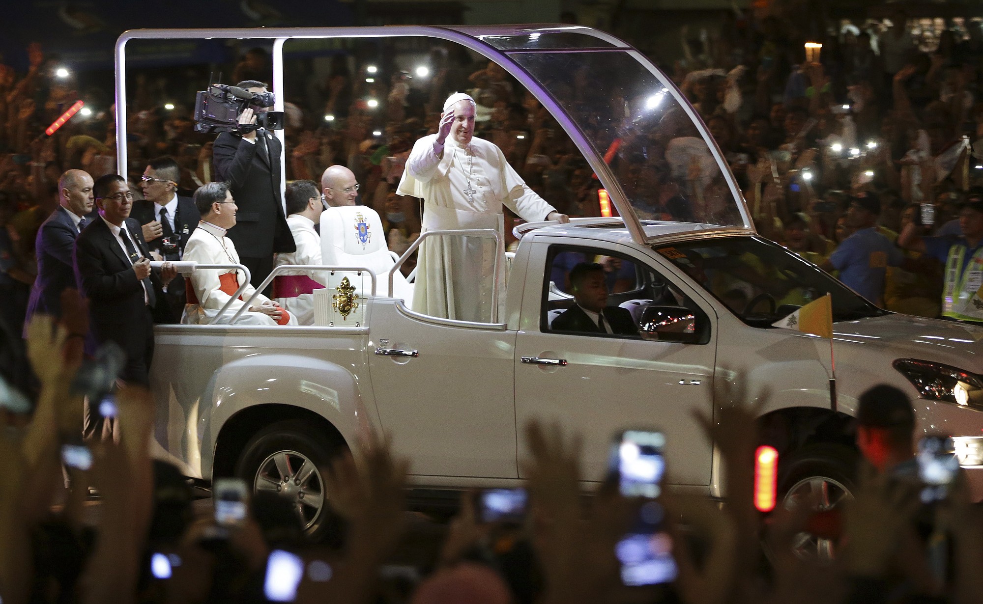 Pope Francis waves upon his arrival Thursday in Manila, Philippines.