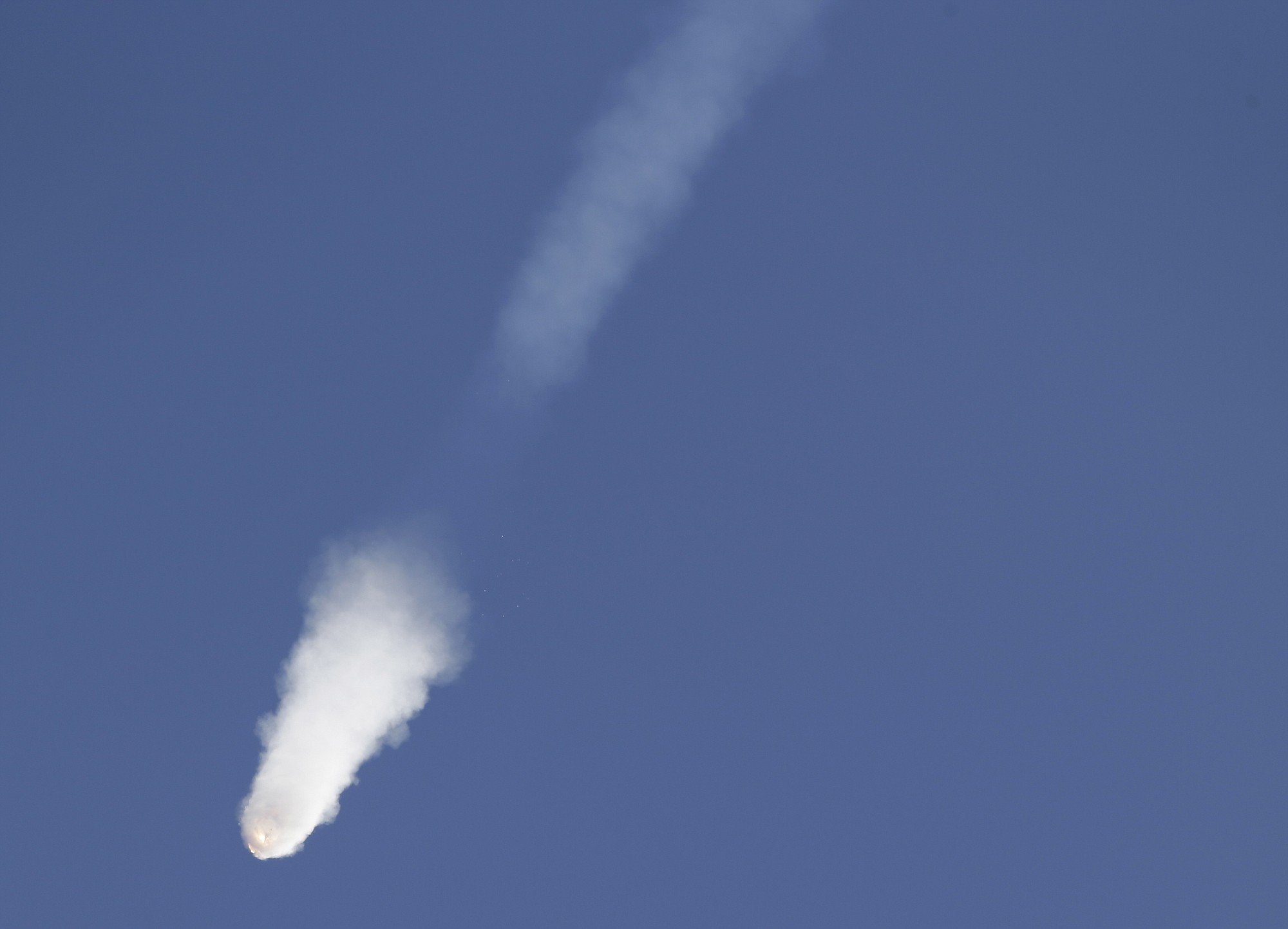 The SpaceX Falcon 9 rocket and Dragon spacecraft breaks apart shortly after liftoff Sunday from the Cape Canaveral Air Force Station in Cape Canaveral, Fla.