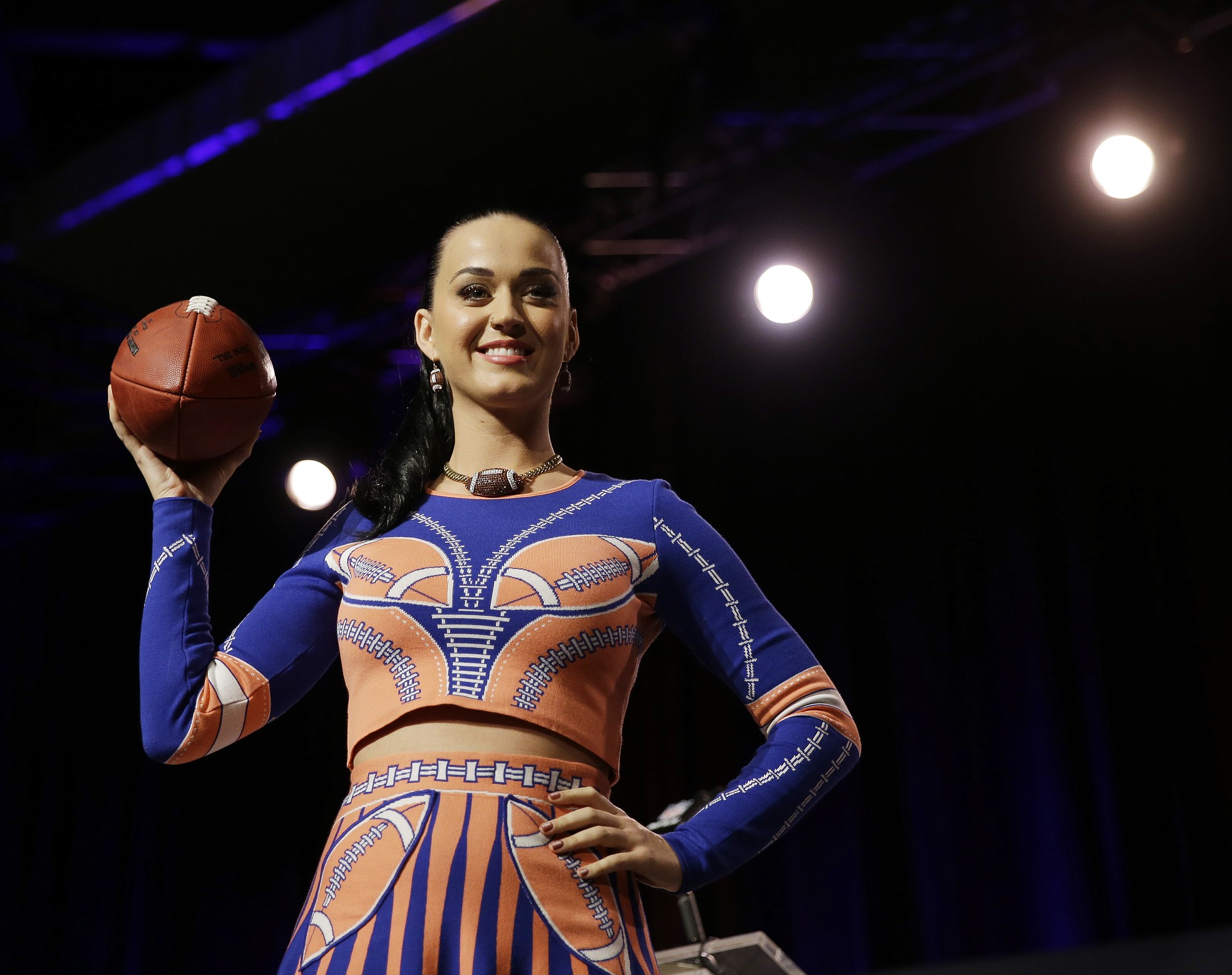 Katy Perry shows off her dress at a news conference Thursday for the halftime show of Super Bowl XLIX. (AP Photo/David J.