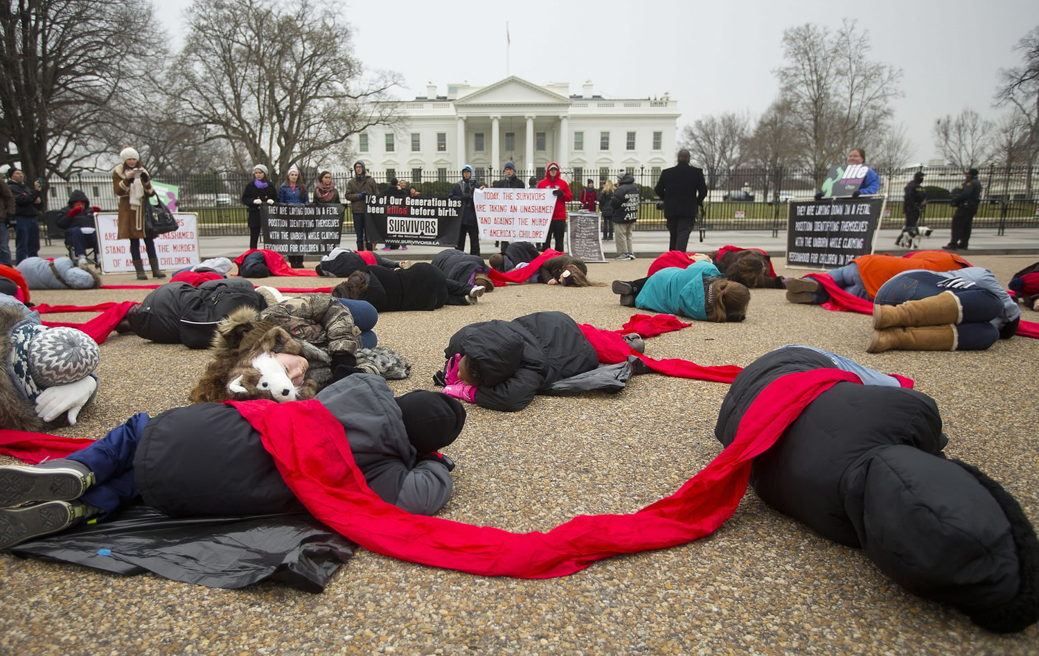 Anti-abortion activists stage a &quot;die-in&quot; in front of the White House on Wednesday in Washington.