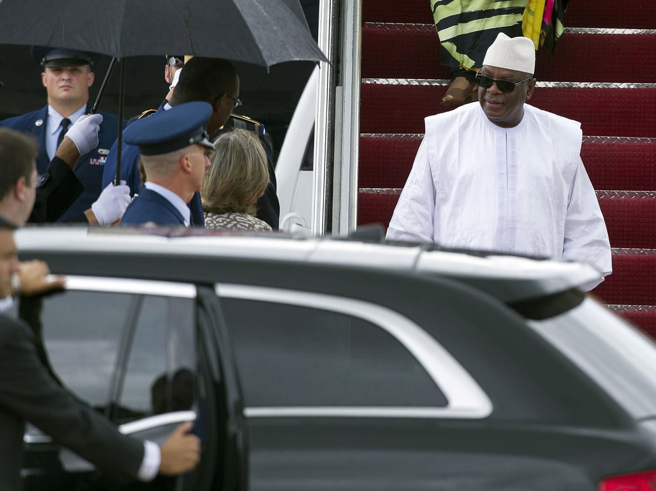 Mali President Ibrahim Boubacar Keita, right, arrives Sunday at Andrews Air Force Base, Md., to attend the U.S.-Africa Leaders Summit.