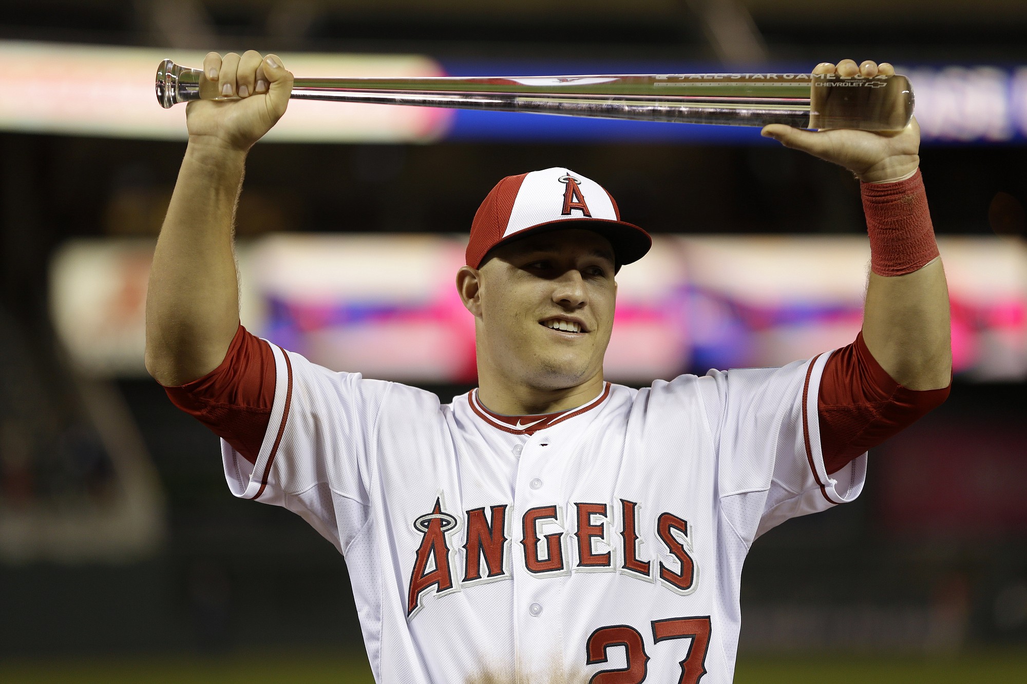 American League outfielder Mike Trout, of the Los Angeles Angels, holds the MVP trophy after his team's 5-3 victory over the National League in the MLB All-Star Game, Tuesday, July 15, 2014, in Minneapolis.