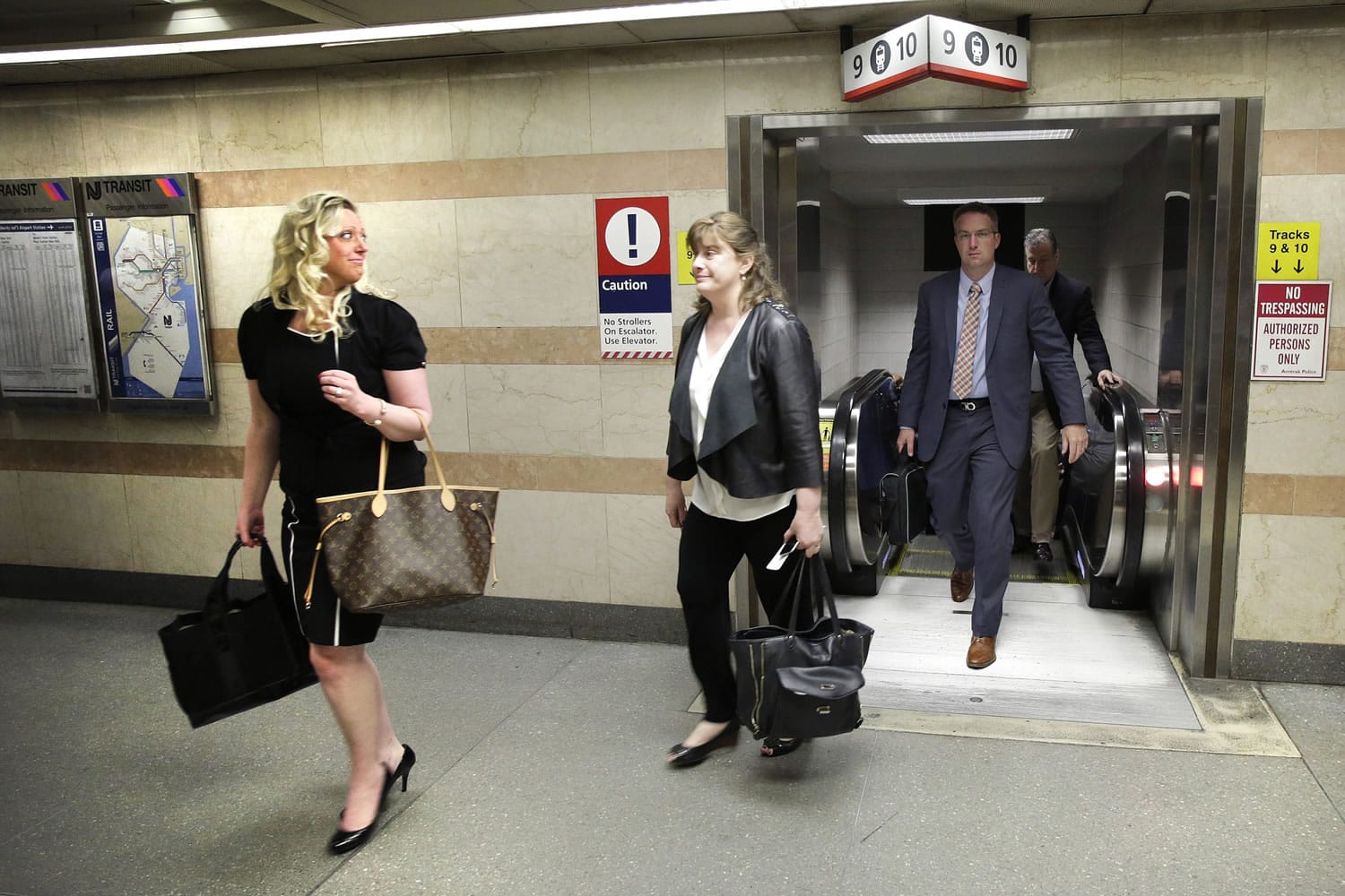 Amtrak passengers arrive in New York's Penn Station from Philadelphia on Monday.
