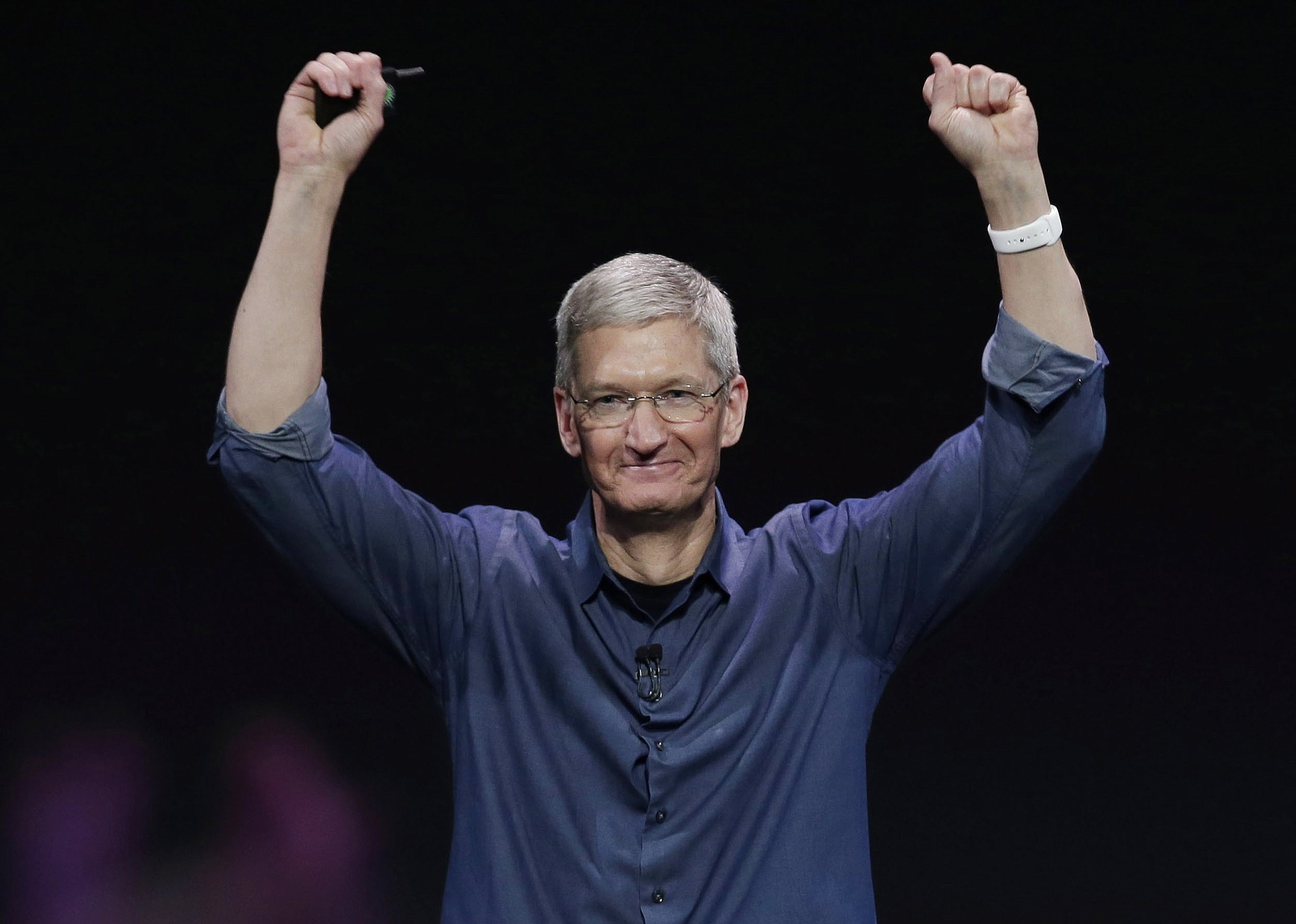 Apple CEO Tim Cook introduces Apple Watch, which he is wearing on his wrist in Cupertino, Calif.