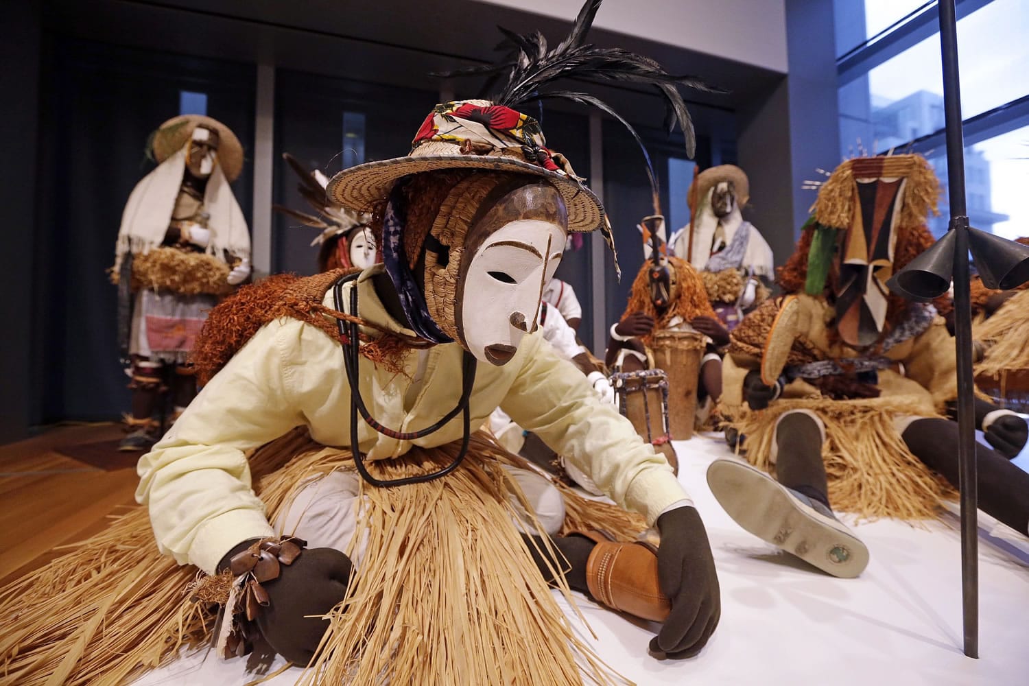 Nigerian masks from the 1950s are displayed Sunday with costumes to create a &quot;masquerade parade&quot; as part of the show &quot;Disguise: Masks