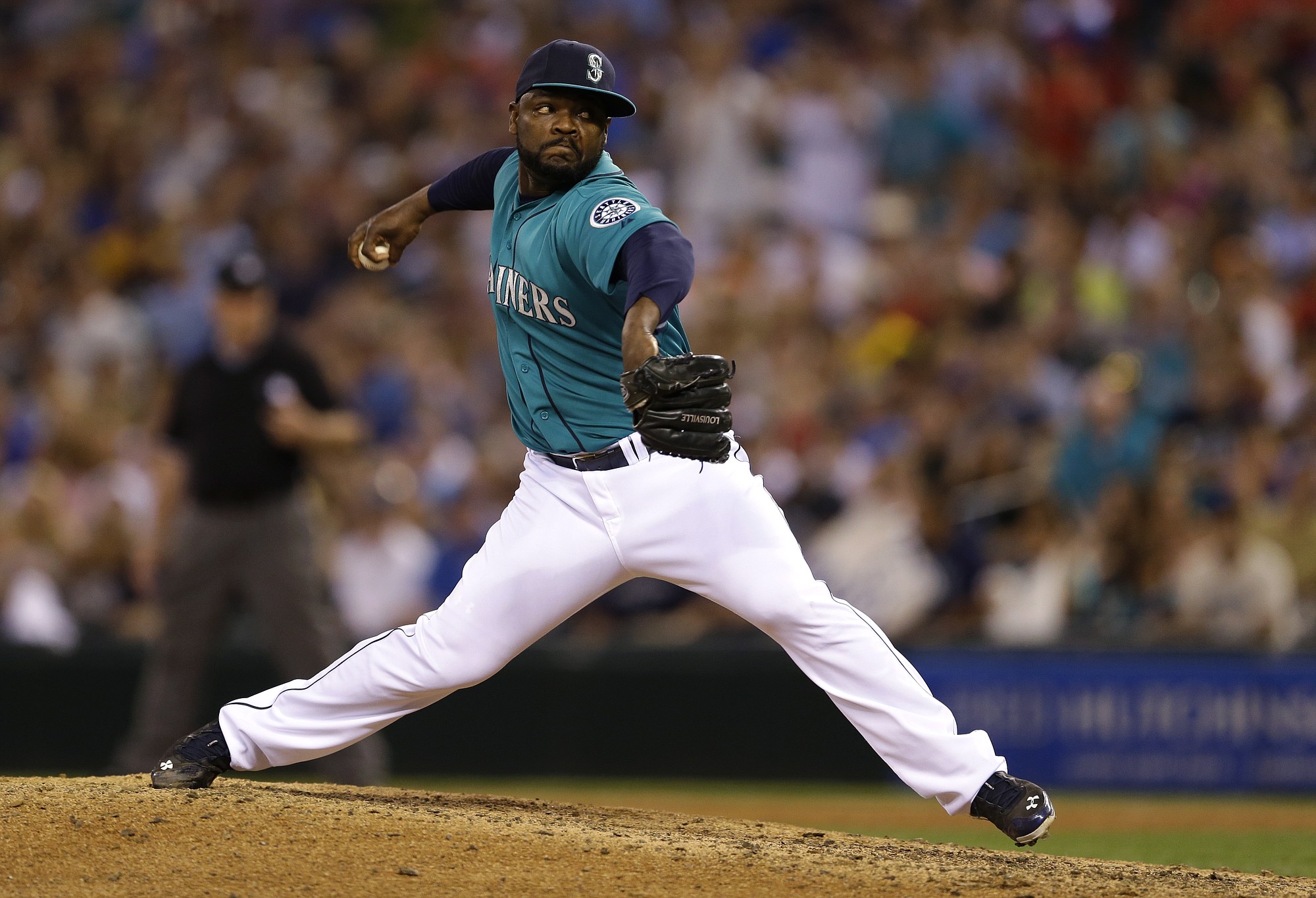 Seattle Mariners closer Fernando Rodney throws in the ninth inning of a baseball game against the Oakland Athletics, Friday, July 11, 2014, in Seattle. The Mariners won 3-2. (AP Photo/Ted S.