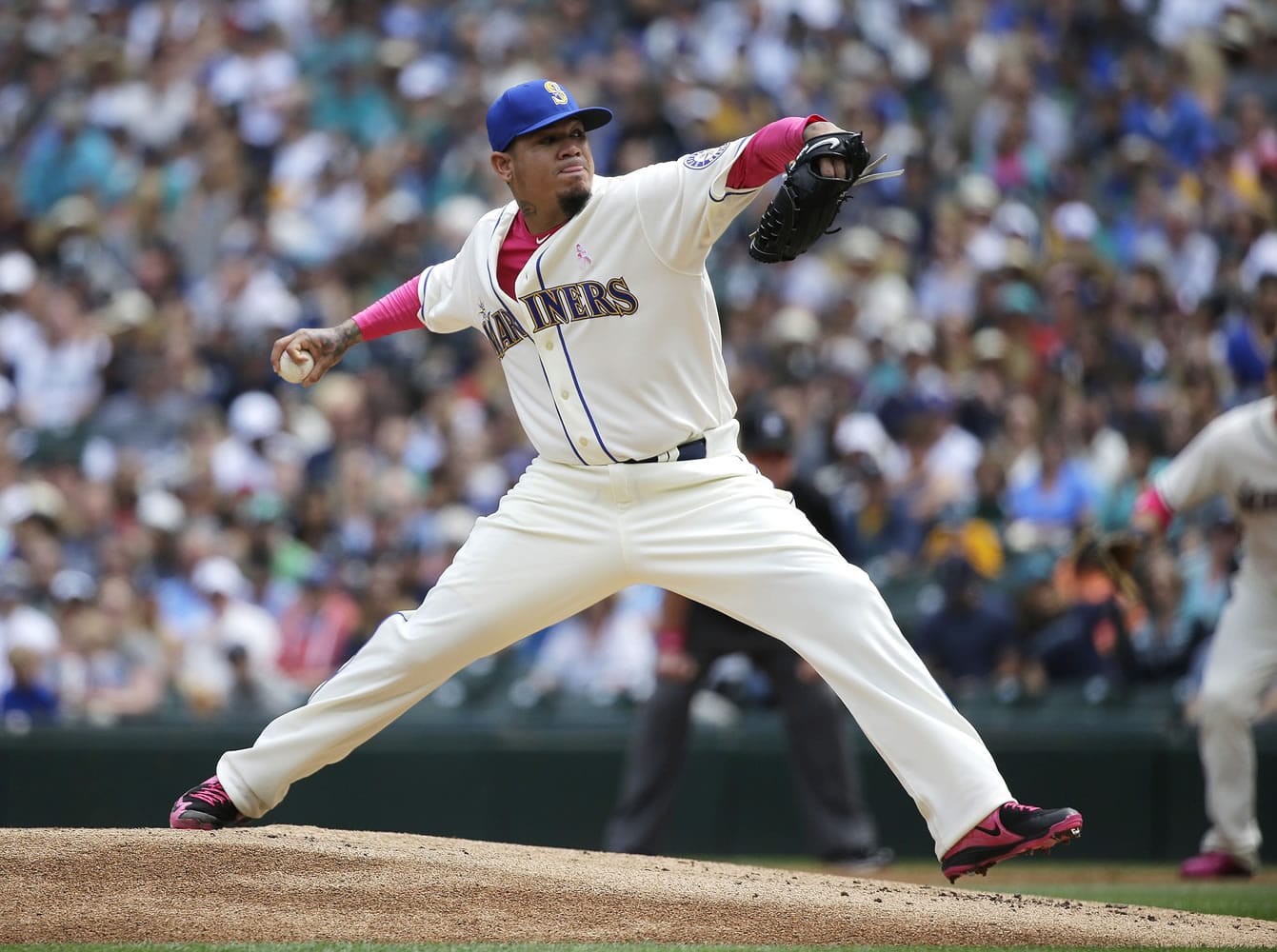 Felix Hernandez reached 2,000 career strikeouts to lead the Seattle Mariners to a 4-3 win against the Oakland Athletics on Sunday, May 10, 2015 in Seattle. Hernandez and other players were wearing pink on Mother's Day for breast cancer awareness. (AP Photo/Ted S.