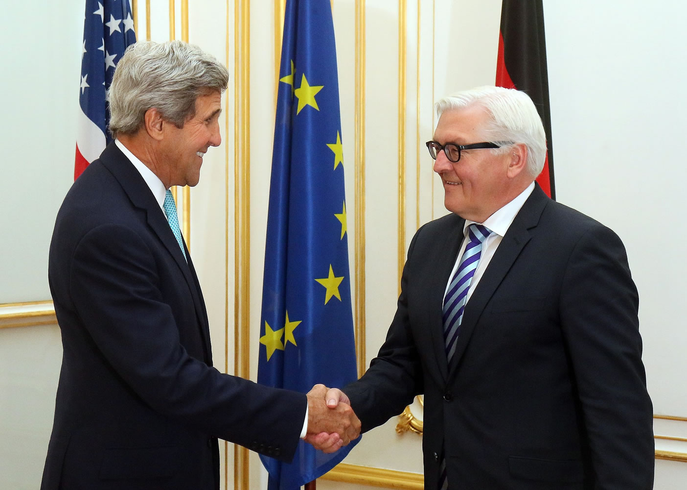 Secretary of State John Kerry, left, shakes hands with German Foreign Minister Frank-Walter Steinmeier on Sunday in Vienna, the site of closed-door nuclear talks.