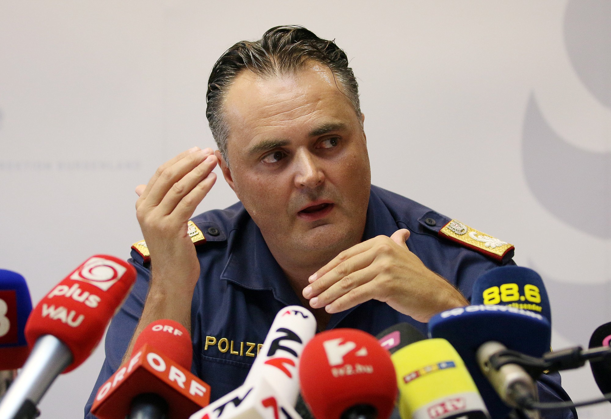 Chief of the Burgenland police, Hans Peter Doskozil,  informs the media at  a news conference  at a police station in Eisenstadt, Austria, on Thursday.
