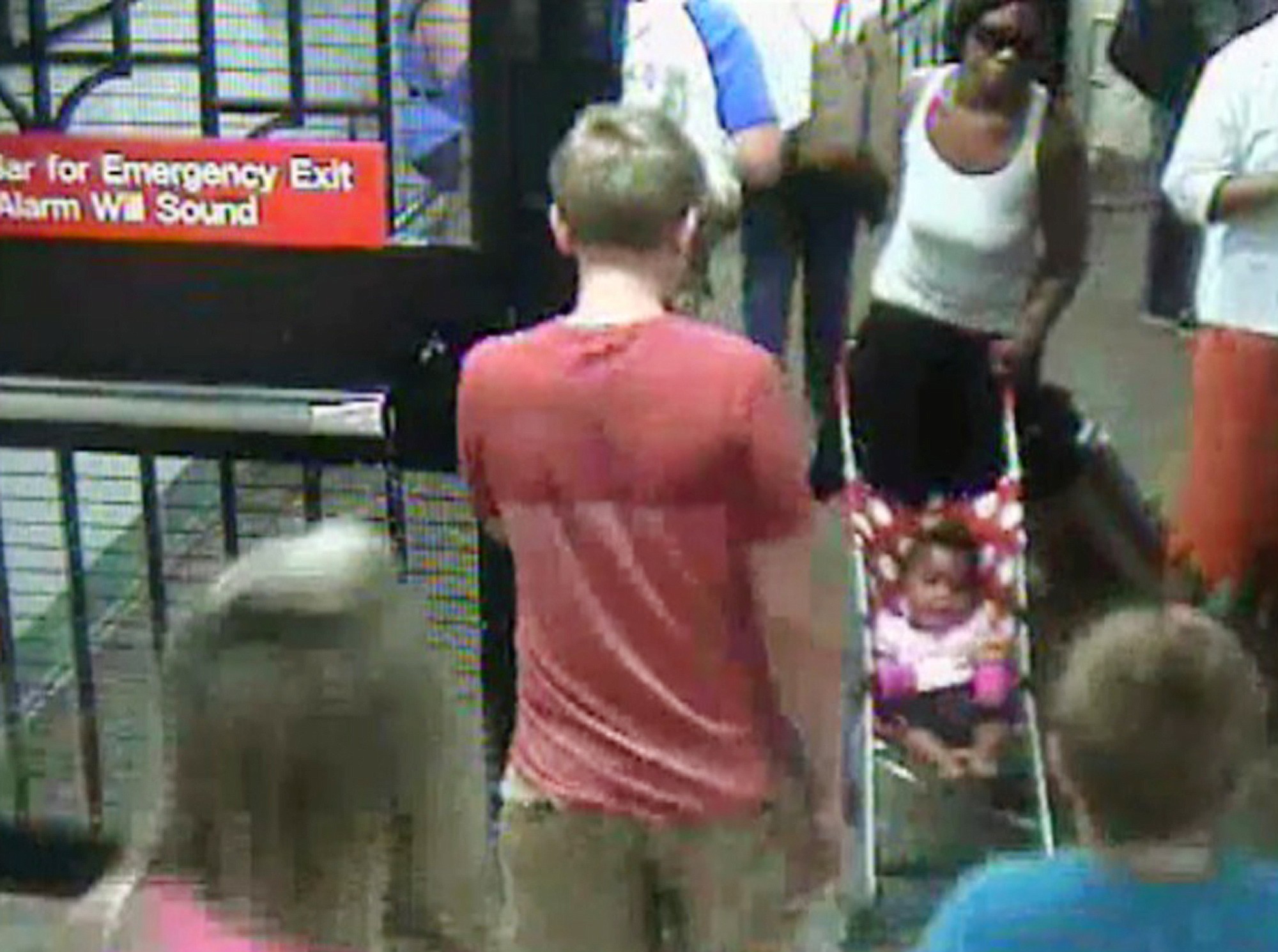 NYPD/Associated Press
In this surveillance camera image, a woman, top right, pushes her baby girl in a stroller at the Columbus Circle subway station in New York.