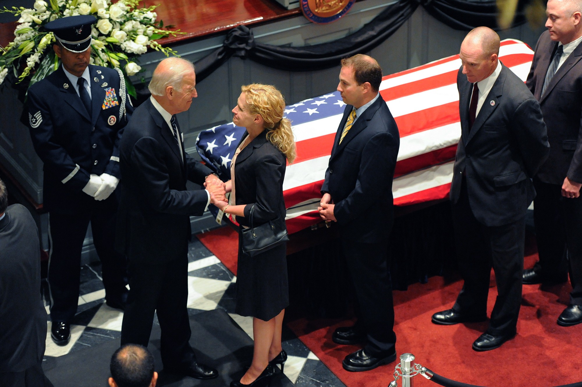 Vice President Joe Biden greets mourners near a casket containing the remains of Biden's son, former Delaware Attorney General Beau Biden, during a viewing, Thursday, June 4, 2015, at Legislative Hall in Dover, Del. Beau Biden died of brain cancer Saturday at age 46.