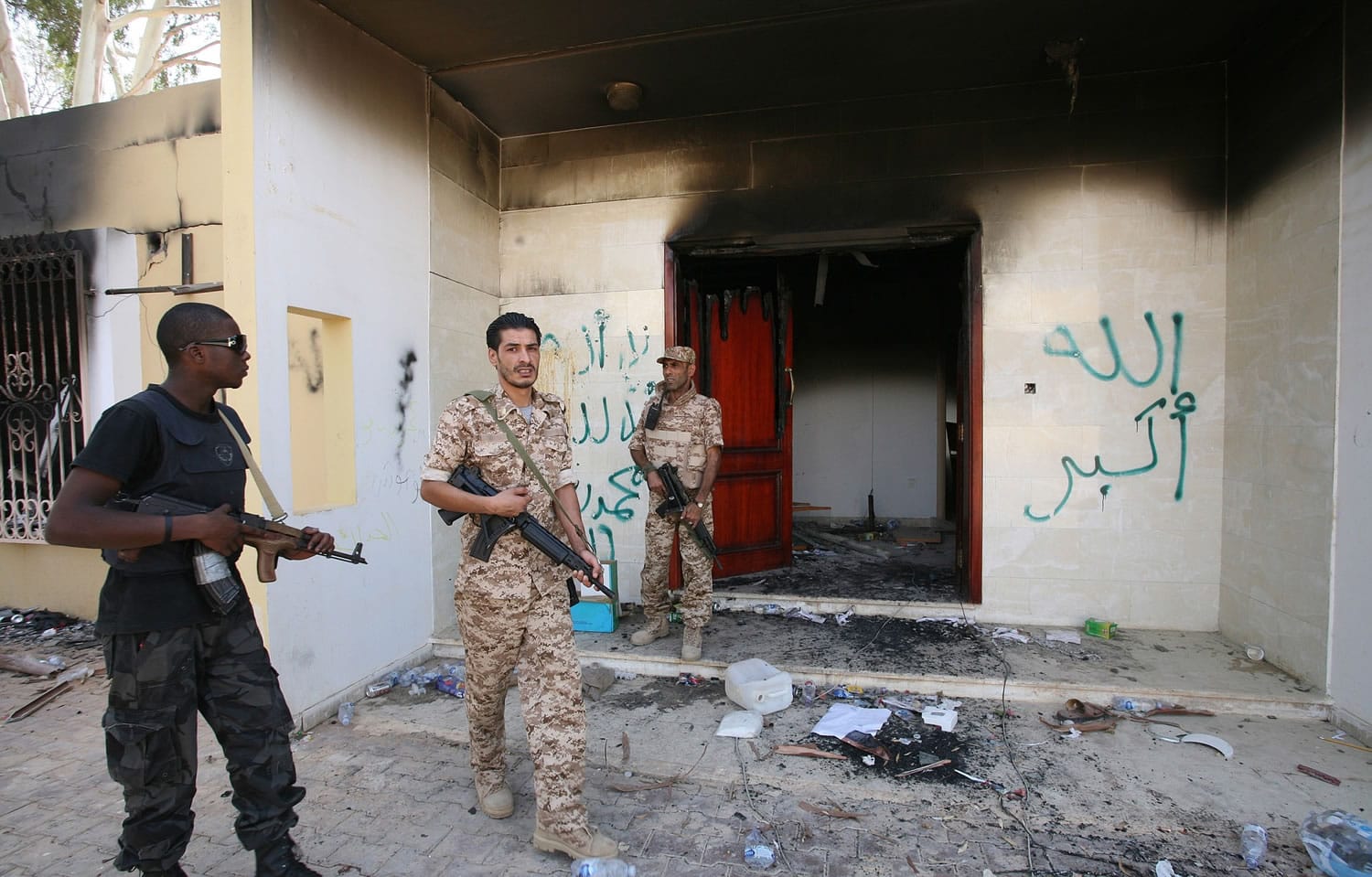 Libyan military guards check one of the U.S. consulateu2019s burned buildings Sept. 14, 2012, after a deadly attack Sept.