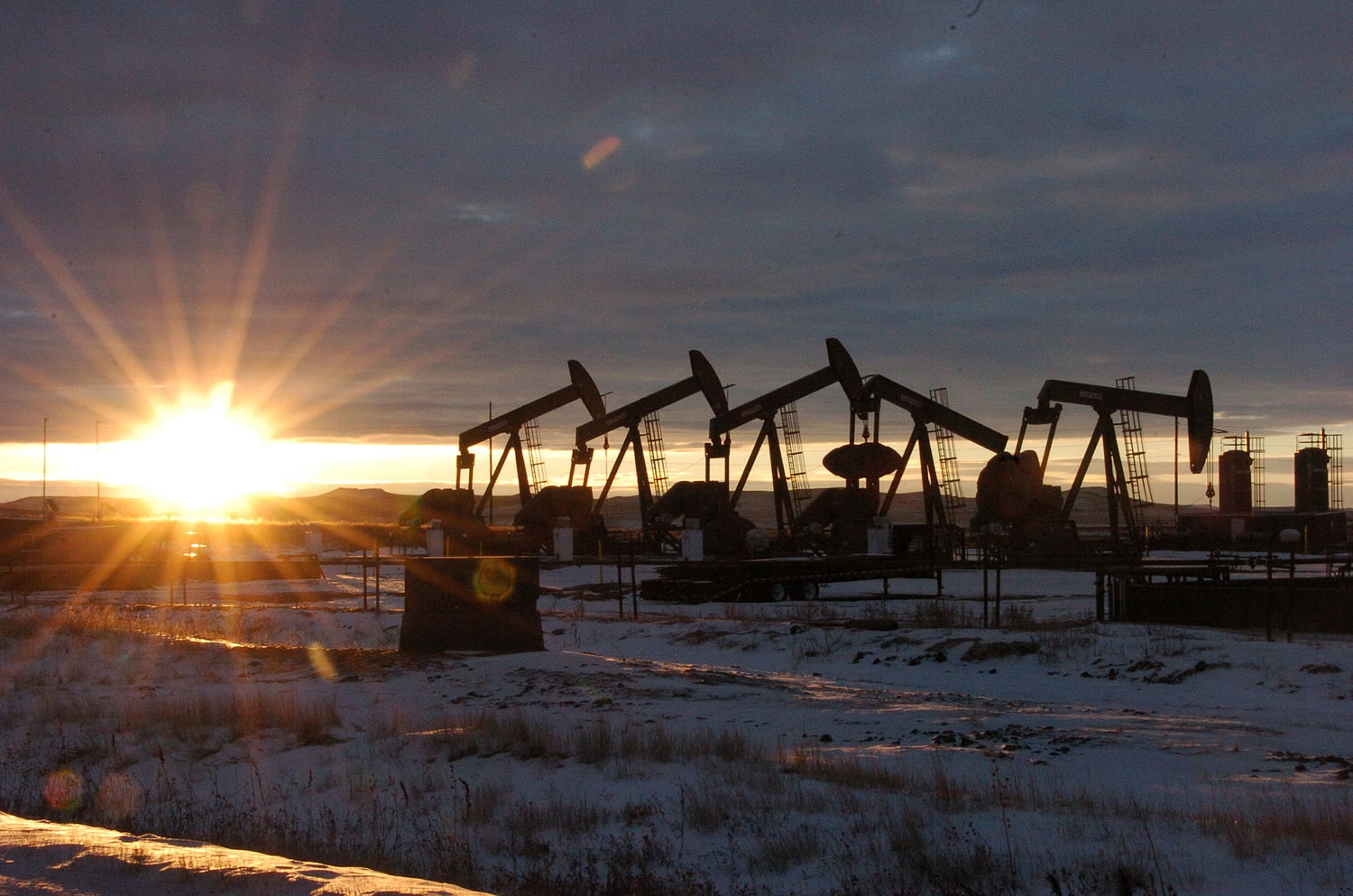 Associated Press files
Some of the 60 oil rigs that surround McKenzie County, N.D., work in January.