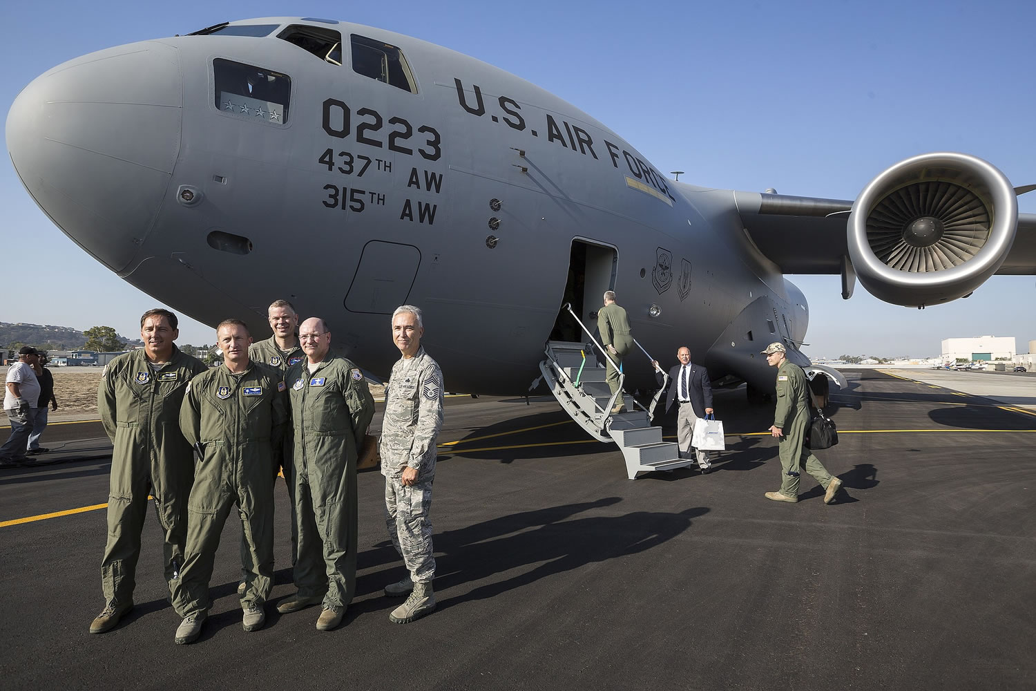 Boeing Co. delivers the last C-17 Globemaster III cargo jet for the U.S. Air Force at the aerospace company's plant to members of the U.S. Air Force in Long Beach, Calif., on Thursday.