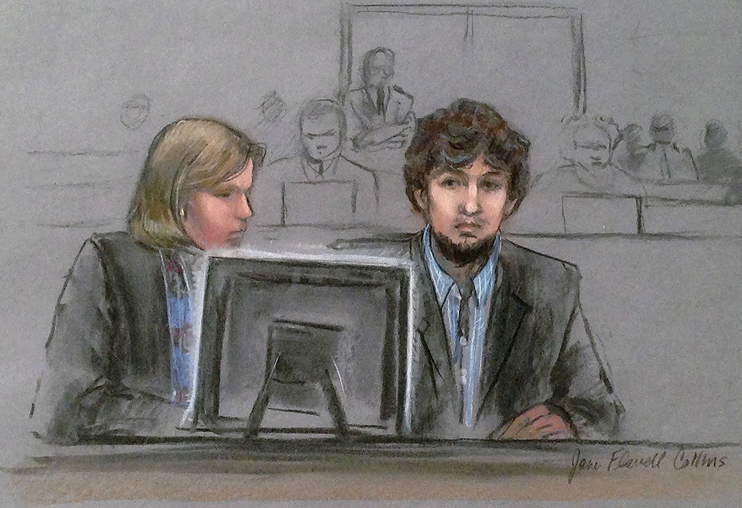 In this courtroom sketch, Dzhokhar Tsarnaev, right, and defense attorney Judy Clarke are depicted watching evidence displayed on a monitor during his federal death penalty trial Monday in Boston.