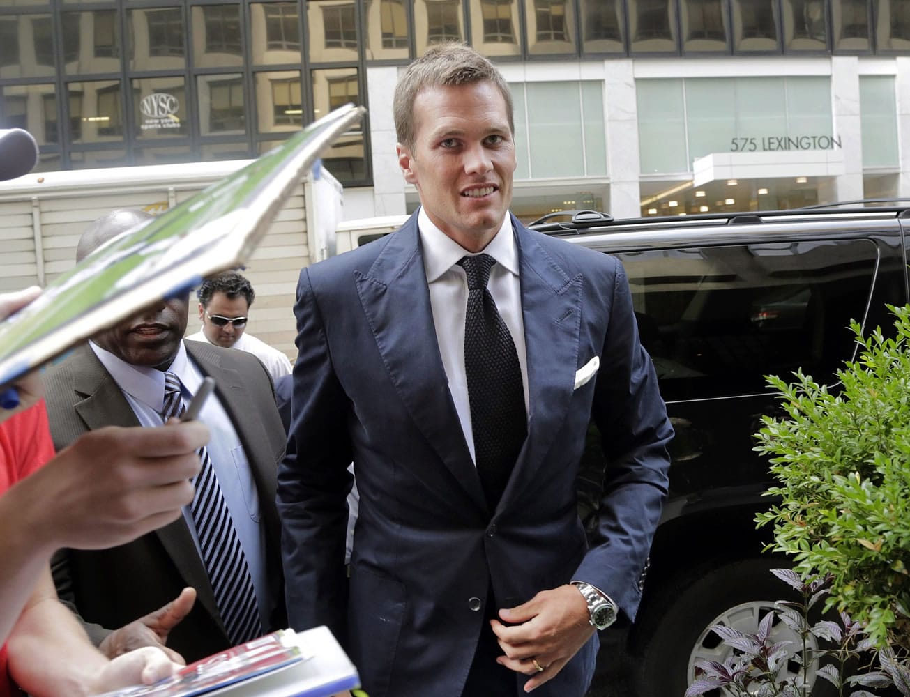 New England Patriot's quarterback Tom Brady arrives for his June appeal hearing at NFL headquarters in New York.