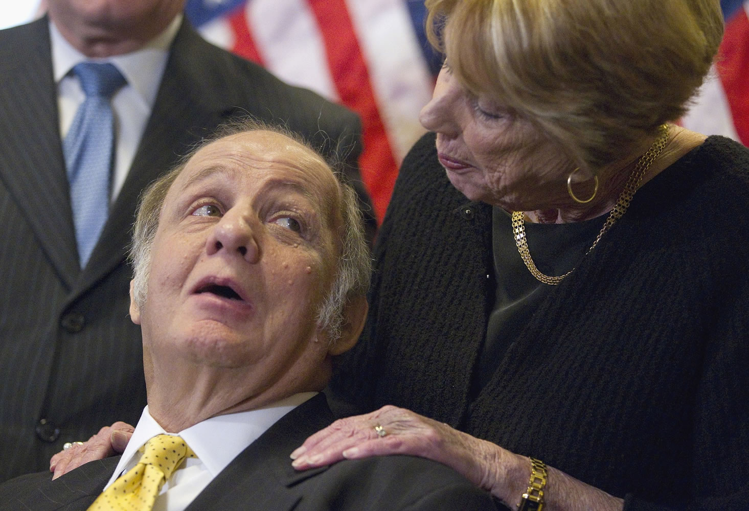 FILE - This March 30, 2011 file photo shows former White House press secretary James Brady, left, who was left paralyzed in the Reagan assassination attempt, looking at his wife Sarah Brady, during a news conference on Capitol Hill in Washington marking the 30th anniversary of the shooting. A Brady family spokeswoman says Brady has died at 73.