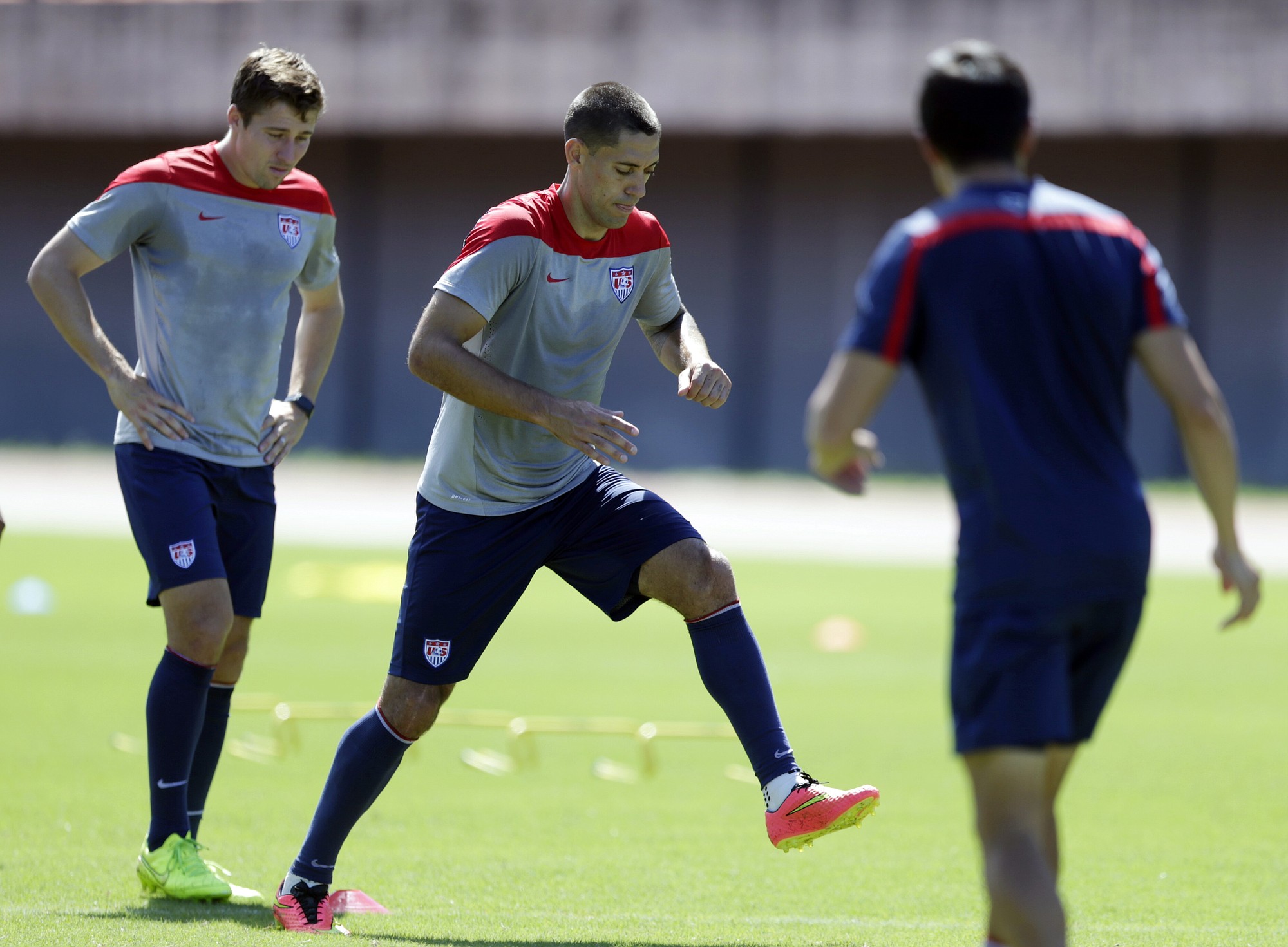 United Statesu2019 Clint Dempsey, center, and Matt Besler, left, work out during a training session in Salvador, Brazil, Monday.