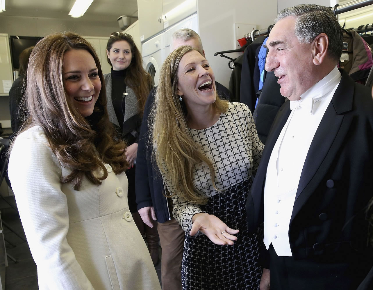 Britain's Kate, Duchess of Cambridge, left, chats with actor Jim Carter who plays the butler, Carson, during an official visit to the set of the TV series &quot;Downton Abbey&quot; at Ealing Studios in London earlier this month.