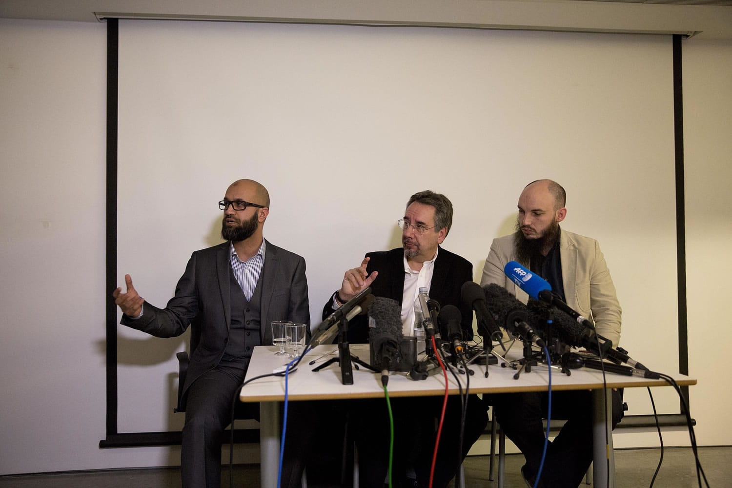 CAGE research director Asim Qureshi, from left, speaks next to political activist John Rees and spokesman Cerie Bullivant during a press conference held by the CAGE human rights charity in London on Thursday.