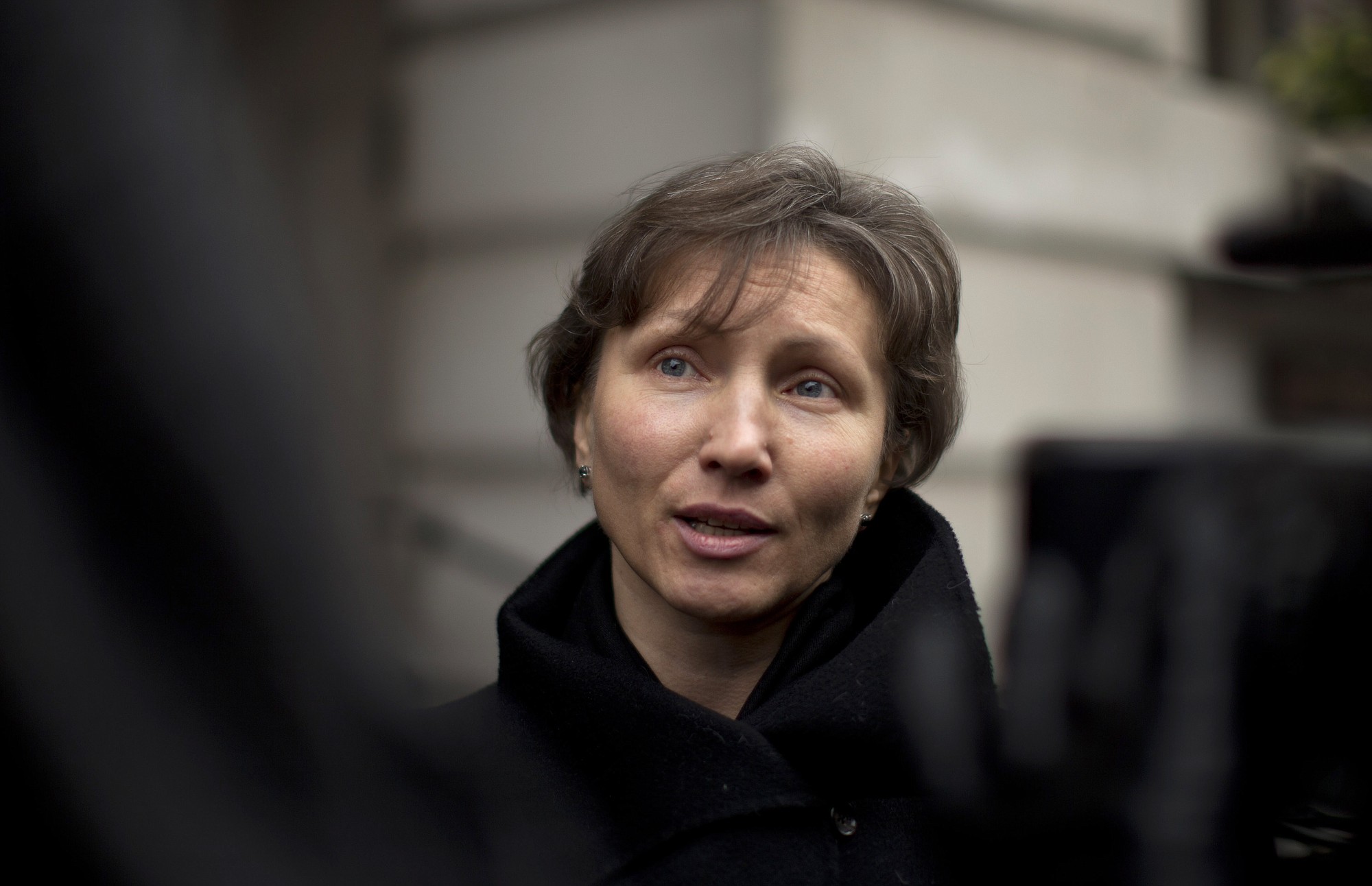 FILE - In this Thursday, Dec. 13, 2012 file photo, Marina Litvinenko, the widow of former Russian intelligence officer Alexander Litvinenko, speaks to the media as she leaves at the end of a pre-inquest review at Camden Town Hall in London. More than eight years on and with the U.K.-Russia relations at their iciest since the Cold War, an inquiry is opening on Tuesday, Jan. 27, 2015 into the killing of the Russian intelligence agent turned Kremlin critic.