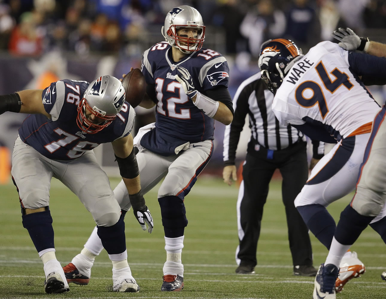 New England Patriots quarterback Tom Brady (12) drops back to pass in the first half against the Denver Broncos on Sunday, Nov. 2, 2014, in Foxborough, Mass.