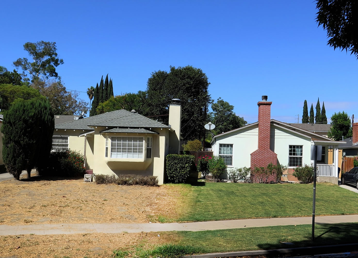 Two homes sit along Valleyheart Drive, in Studio City, Calif.