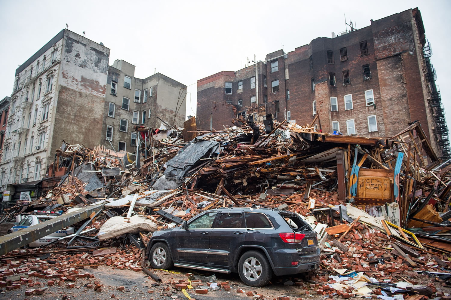 A pile of debris remains at the site of a building explosion in the East Village neighborhood of New York, Friday, March 27, 2015. Nineteen people were injured, four critically, after the powerful blast and fire sent flames soaring and debris flying Thursday afternoon.  Preliminary evidence suggested that a gas explosion amid plumbing and gas work inside the building was to blame.