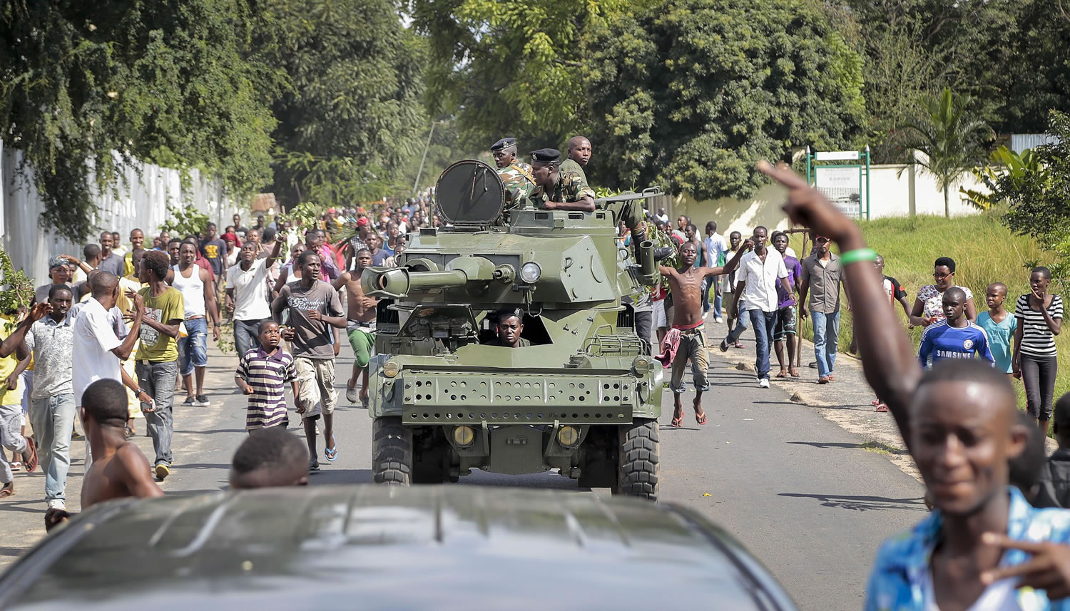 Burundi army soldiers ride through the streets in an armored vehicle as demonstrators celebrate what they perceive to be an attempted military coup d'etat, in the capital Bujumbura, Burundi, on Wednesday.