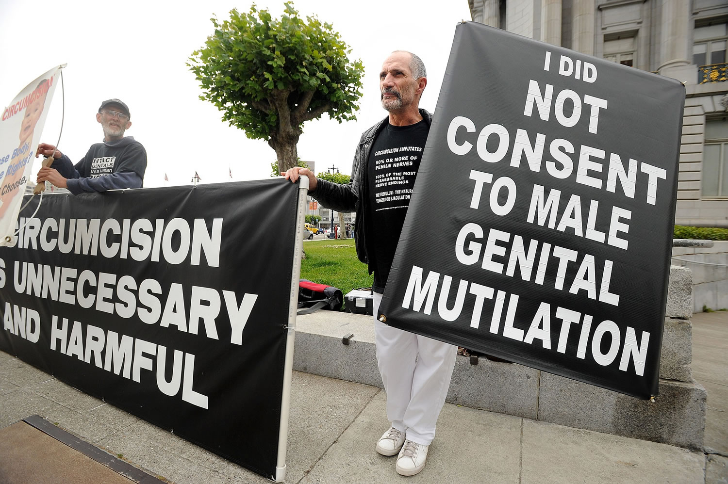 Anti-circumcision activists Frank McGinness, right, and Jeff Brown rally against circumcision with about 25 protesters outside a San Francisco courthouse in 2011.