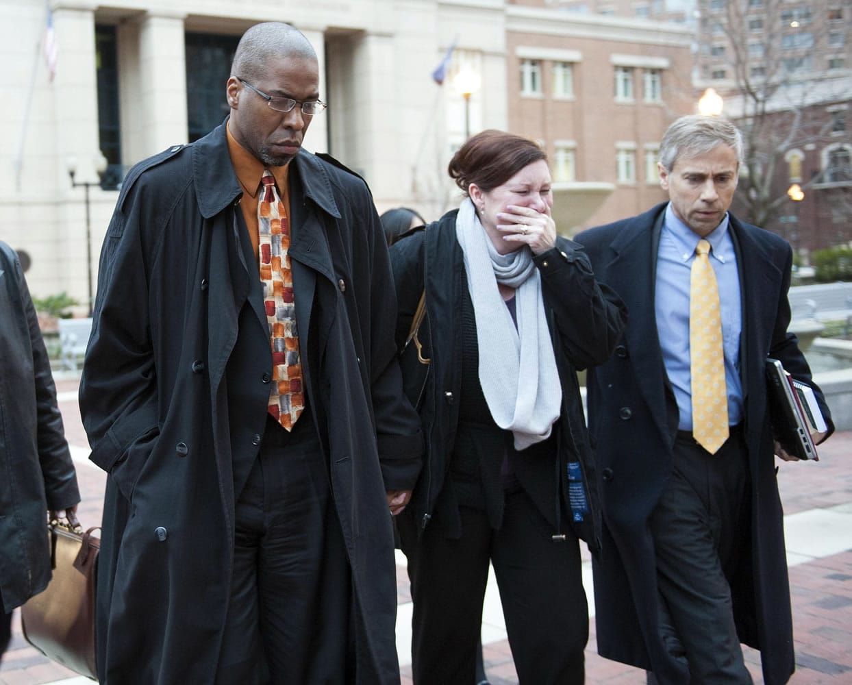 Former CIA officer Jeffrey Sterling, left, leaves the Alexandria Federal Courthouse Monday in Alexandria, Va., with his wife, Holly, and attorney Barry Pollack, after being convicted on all counts he faced of leaking classified details of an operation to a reporter.