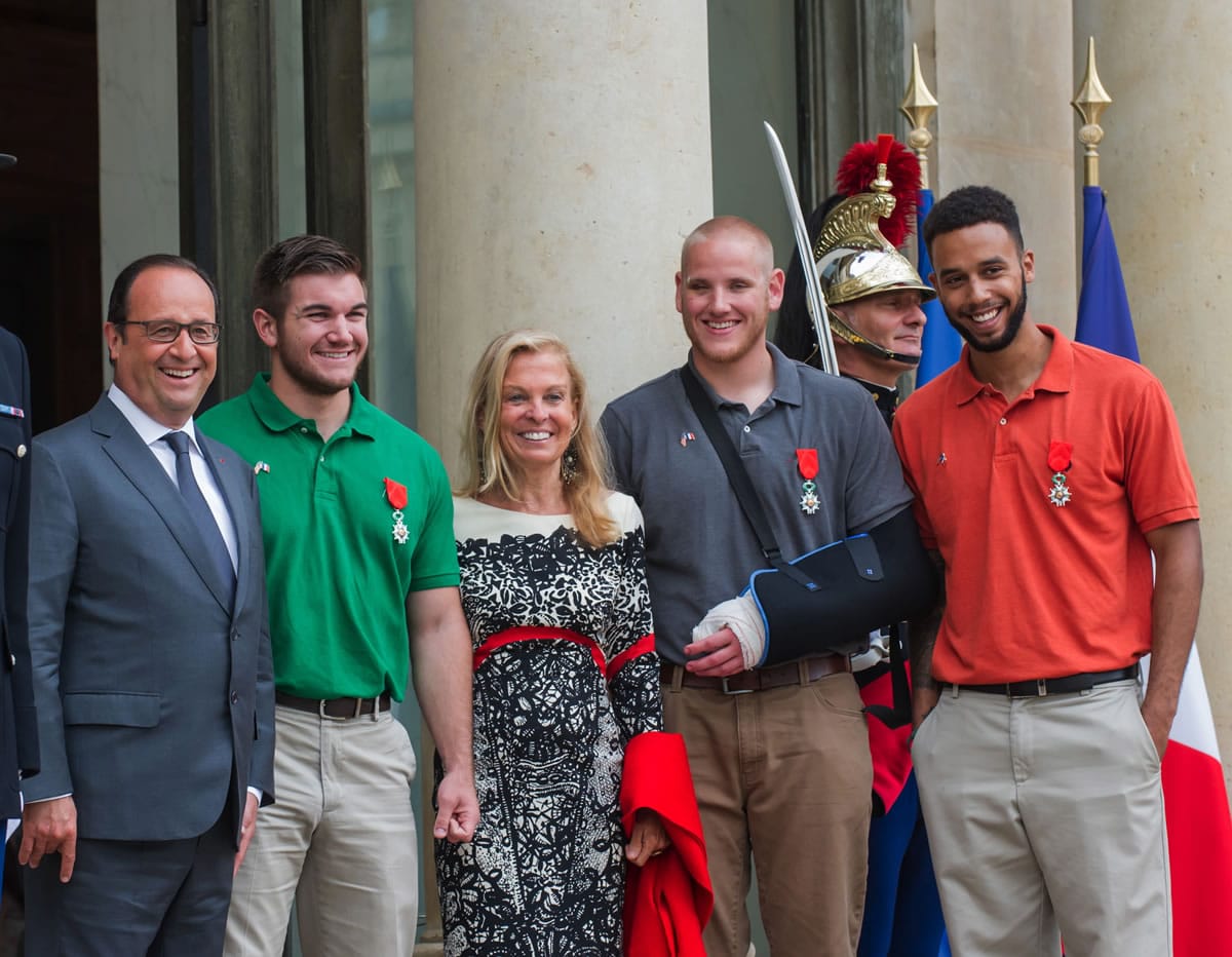 From left, French President Francois Hollande, U.S. National Guardsman from Roseburg, Ore., Alek Skarlatos, U.S. Ambassador to France Jane D. Hartley, U.S. Airman Spencer Stone and Anthony Sadler, a senior at Sacramento State University in California, pose for photographers as they leave the Elysee Palace in Paris, France, after Hollande awarded the three men with the French Legion of Honor on Monday, Aug. 24, 2015. The three American travelers say they relied on gut instinct and a close bond forged over years of friendship as they took down a heavily armed man on a passenger train speeding through Belgium on Friday, Aug. 21.