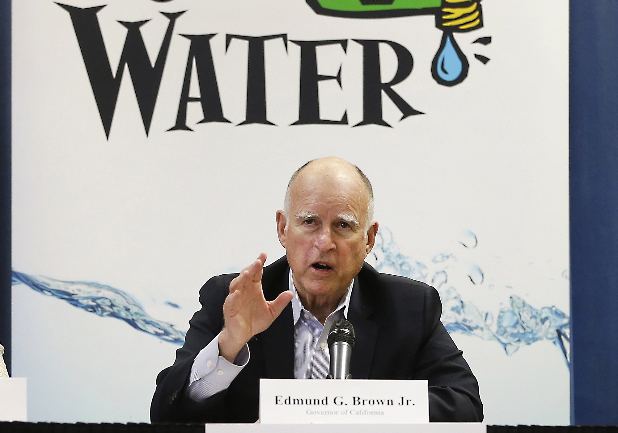 California Gov. Jerry Brown talks with reporters April 16 after a meeting about the drought at his Capitol office in Sacramento, Calif. The State Water Resources Control Board on Tuesday approved sweeping mandatory emergency regulations to protect water supplies as water levels as some of California's lakes and reservoirs continue to decline.