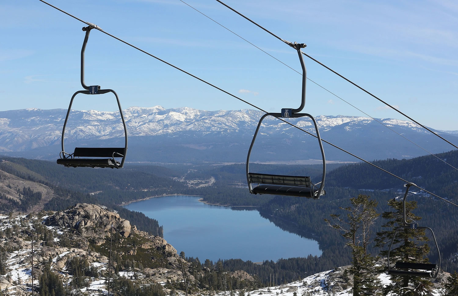 Associated Press files
A ski lift overlooking Donner Lake and slopes of visible rock sits idle Jan. 28 at Donner Ski Ranch in Norden, Calif.