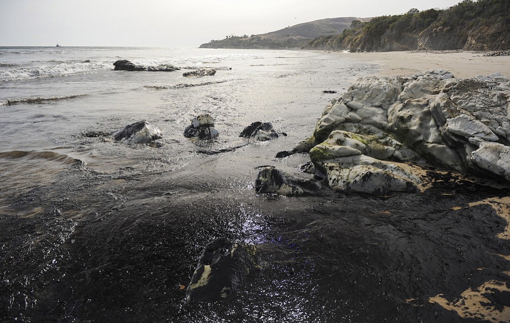 An oil slick washes up on the shore Tuesday near Goleta, Calif. Capt. Dave Zaniboni of the Santa Barbara County Fire Department says the pipeline on the land near Refugio State Beach broke Tuesday and spilled oil into a culvert that ran under the U.S.