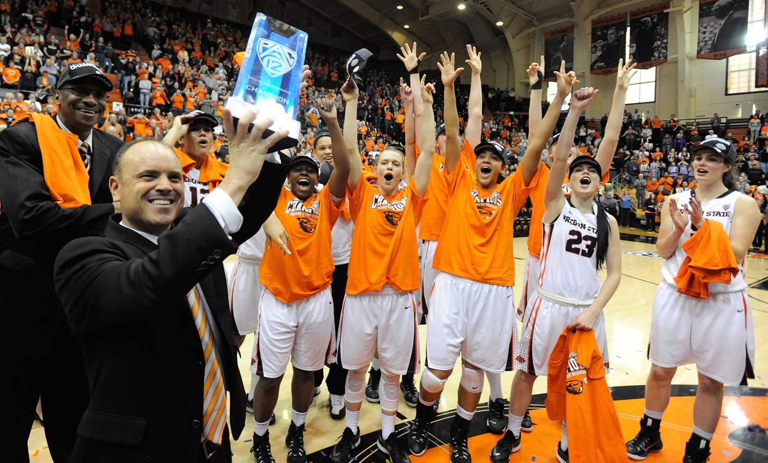 Oregon State head coach Scott Rueck hoists the Pac 12 Championship trophy while celebrating after the Beavers defeated California 73-55 at Gill Coliseum in Corvallis, Ore. on Saturday, Feb. 28, 2015.