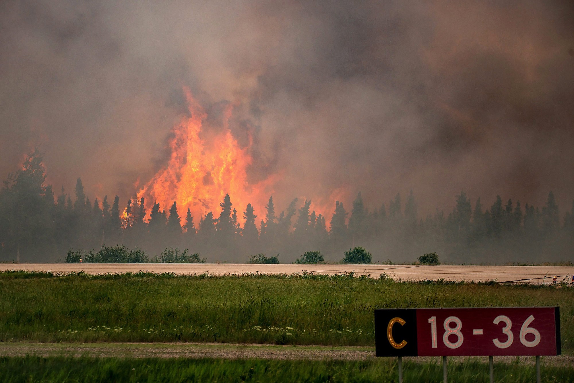 Flames rise from a wildfire near La Ronge, Saskatchewan.