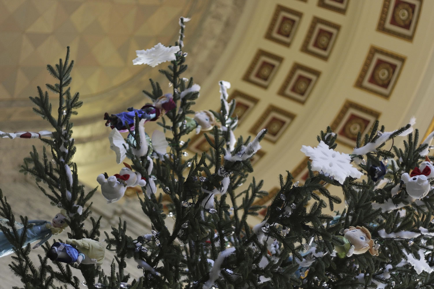 Decorations adorn the state holiday tree in the Capitol Rotunda in Olympia on Monday. The 35-foot noble fir is from a tree farm in Olympia.